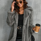 Gray shaggy faux fur coat styled with a coffee cup