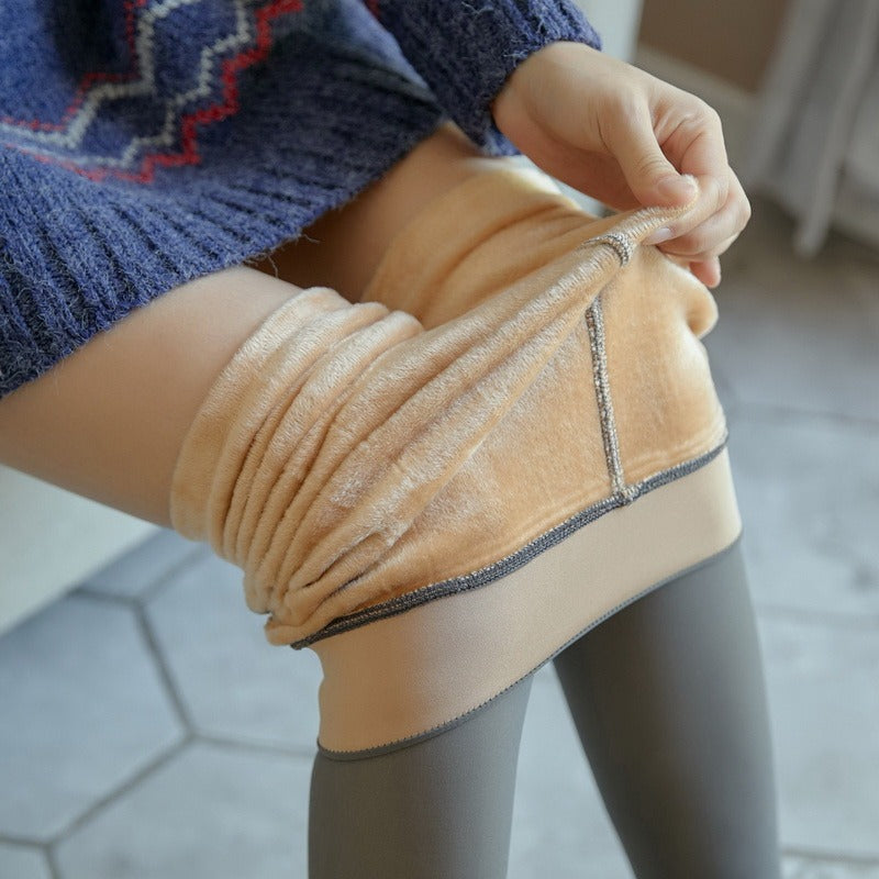 Woman folding down the waistband to show the thick fleece lining