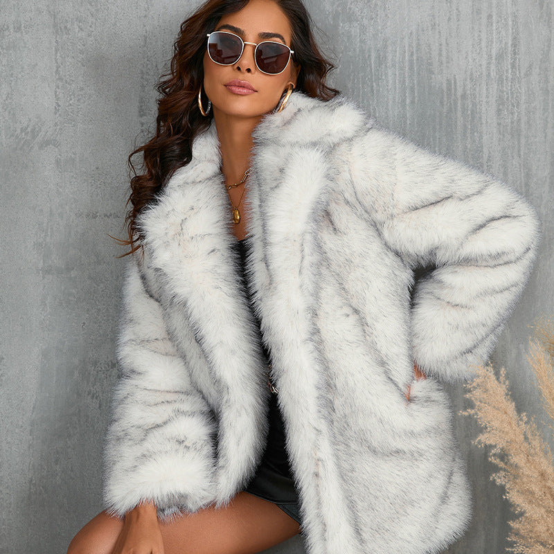 Frost white shaggy faux fur coat with a wide lapel, close-up
