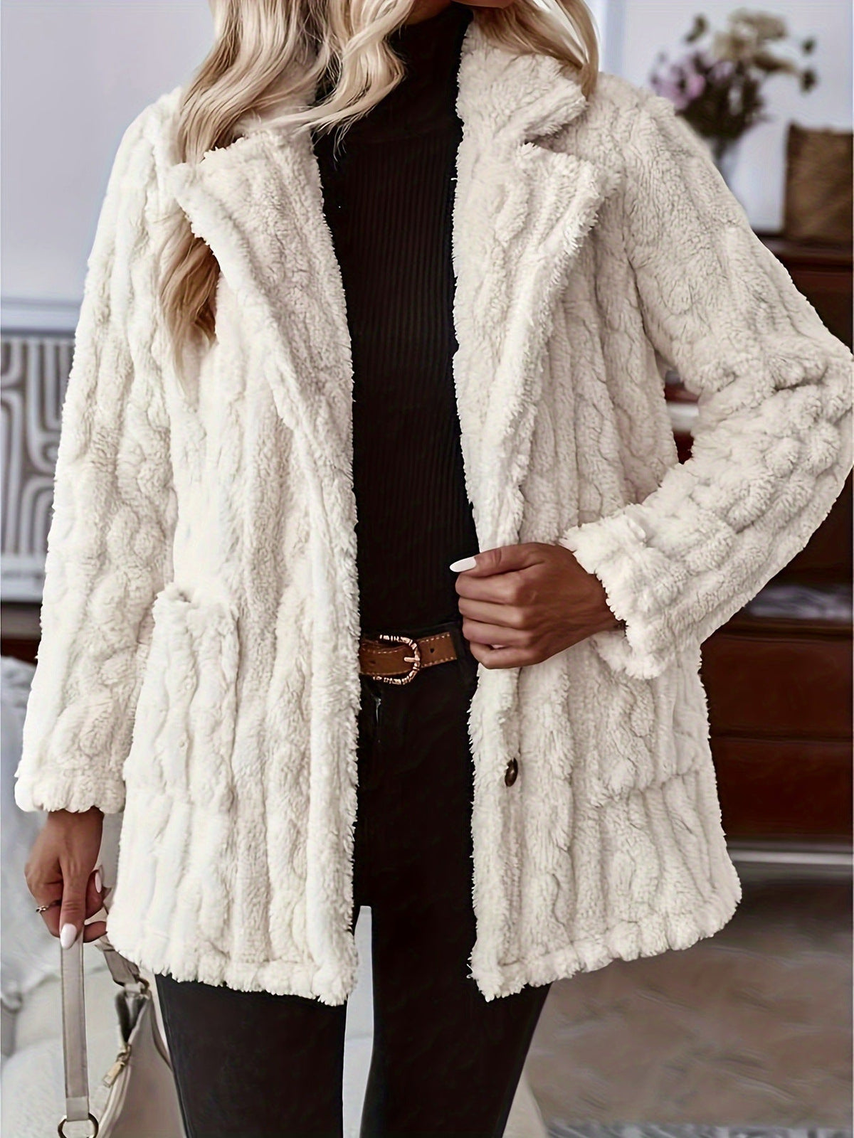 Woman in a cream textured teddy button jacket